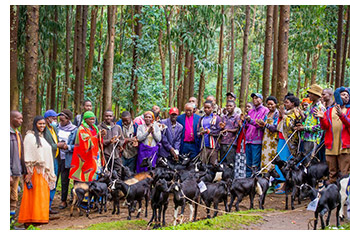 Bishop John Rucyahana and beneficiaries of a recent goat project.